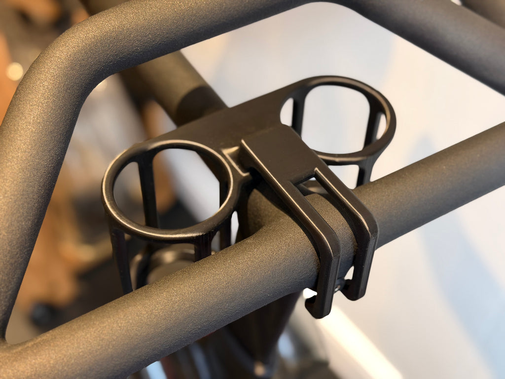 Dual drink can holders for Peloton Bike+