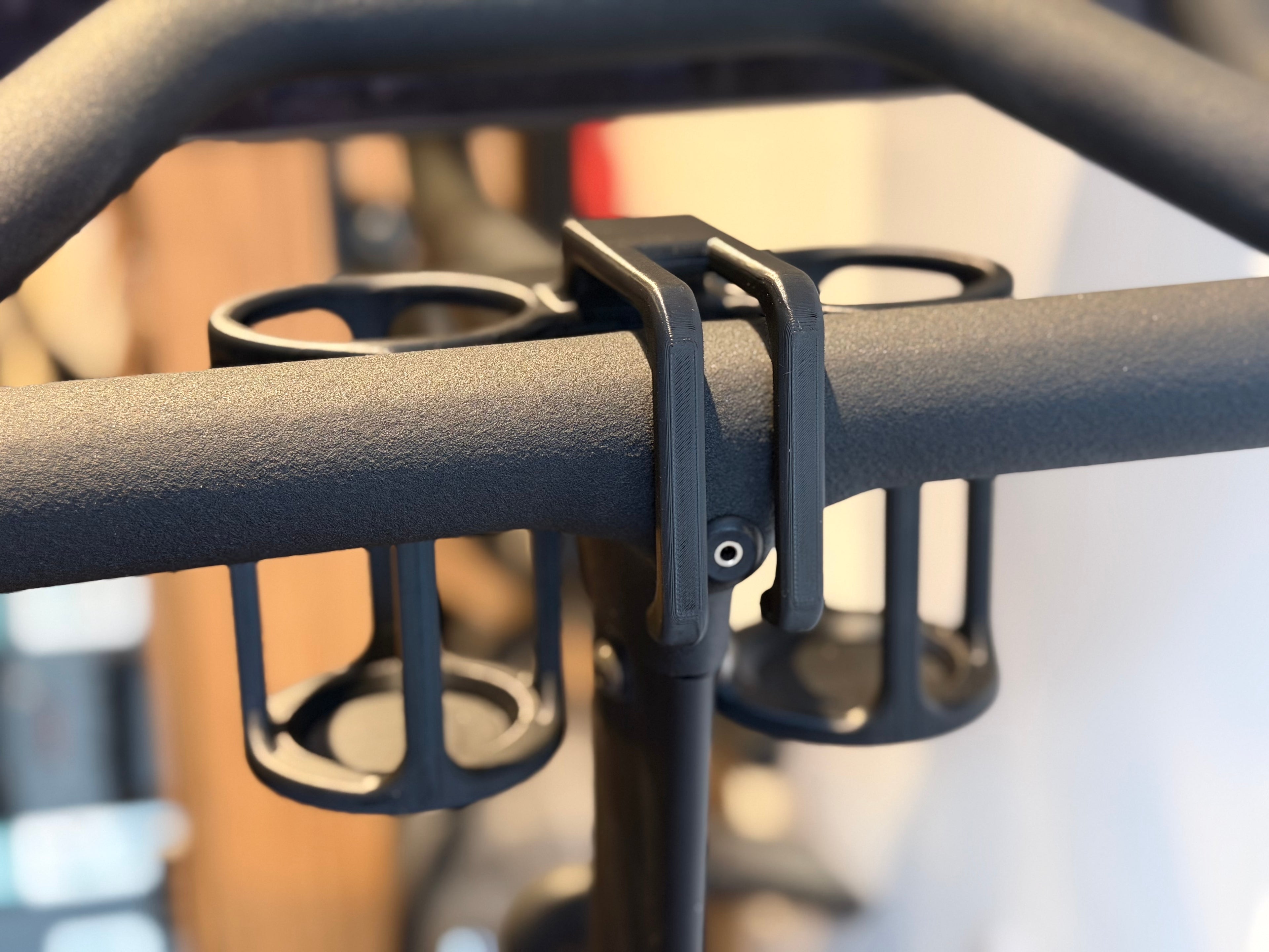 Dual drink can holders for Peloton Bike+